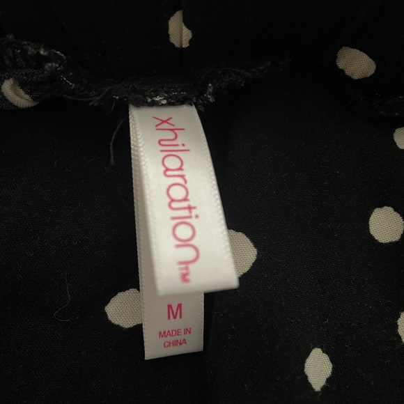 Black/white polka dot flowy pants, elastic waist. Xhiliration brand size medium. - Picture 3 of 3